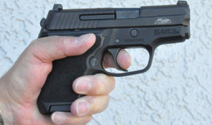 One handed grip on P224, finger below magazine