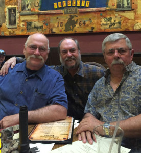 Border Patrol partner Steve Osgood, Streamlight's Jeff Orr and Ed Head at The Palace, with the HL-4 light on the table.