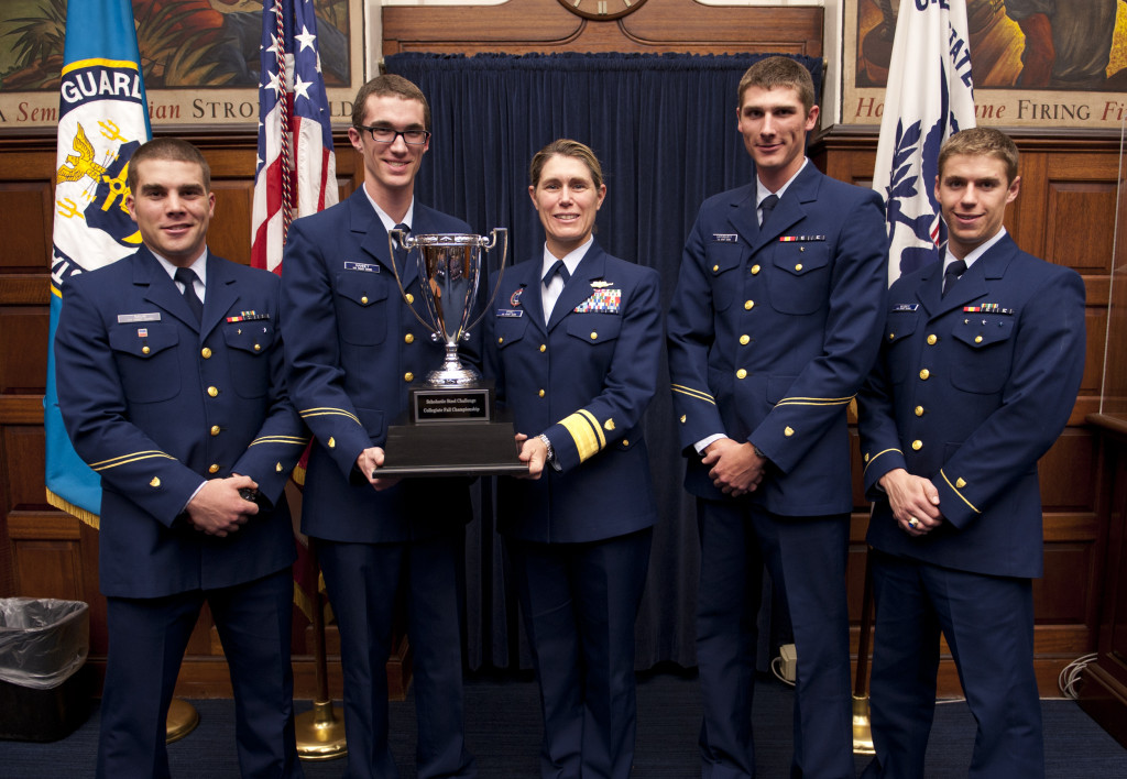 Rear Adm. Sandra Stosz of the USCGA receives trophy from Combat Arms Team