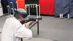 NRA Museum Director Jim Supica tries out the airsoft shotgun during 3-gun practice