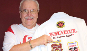 Paul Bartoszewicz poses with his Distinguished Expert shirt