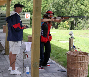 National Shotgun Coach Todd Graves giving some instruction to two-time Olympian Corey Cogdell prior to her Olympic competition in London