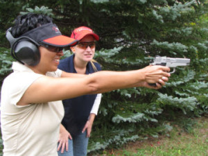 NRA Instructor looks on at Women on Target event.