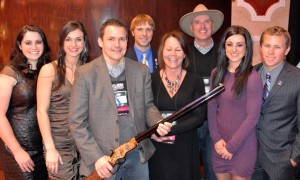 USA Shooting Team Members pose for a photo with one of the supporters who helped raise $100K in support of the USA Shooting Team.