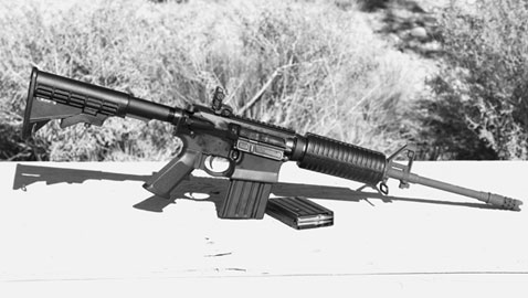 The pre-production GII AP4 introduced at Gunsite rests hot and dirty on a table at Gunsite’s Shot Quad Range.  It never malfunctioned.