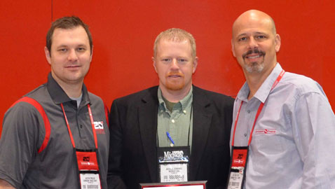Crimson Trace Presenting Michael Jennings, MidwayUSA Optics Product Line Manager, with Elite Retailer of the Year Award