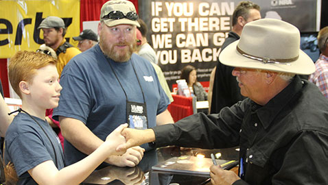 Michael Bane meets a young viewer at the NRA Show in Indianapolis.