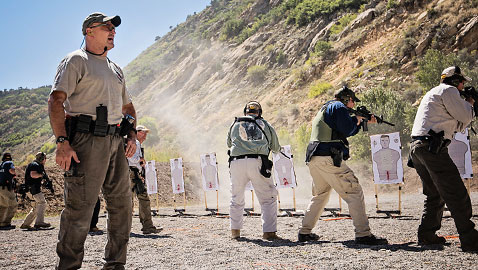 Legendary law enforcement firearms instructor John Krupa III of Team Spartan Tactical Training yells out orders during his Rapid Deployment Rifle course at Action Target's Law Enforcement Training Camp.
