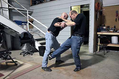 The defender quickly follows with a right kick to the attacker’s shin. This kick is simple and direct and is identical to kicking a soccer ball—just swing your leg hard and kick with the inside edge of your foot against his shin. This will typically cause him to move that leg back and shift his weight to the other leg.